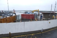 A similar view taken shortly after the station buildings at Carlisle Pier were demolished in October 2009. In the foreground is the site of the former level crossing. A small section of the former signal cabin can be seen behind the construction hoarding.